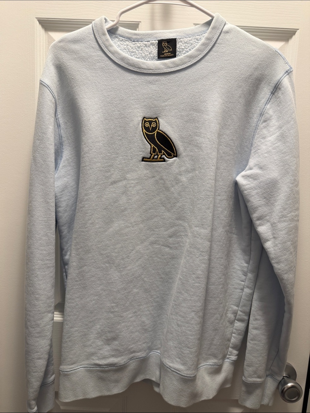 Light Blue Crewneck Sweater with Embroidered Owl Logo